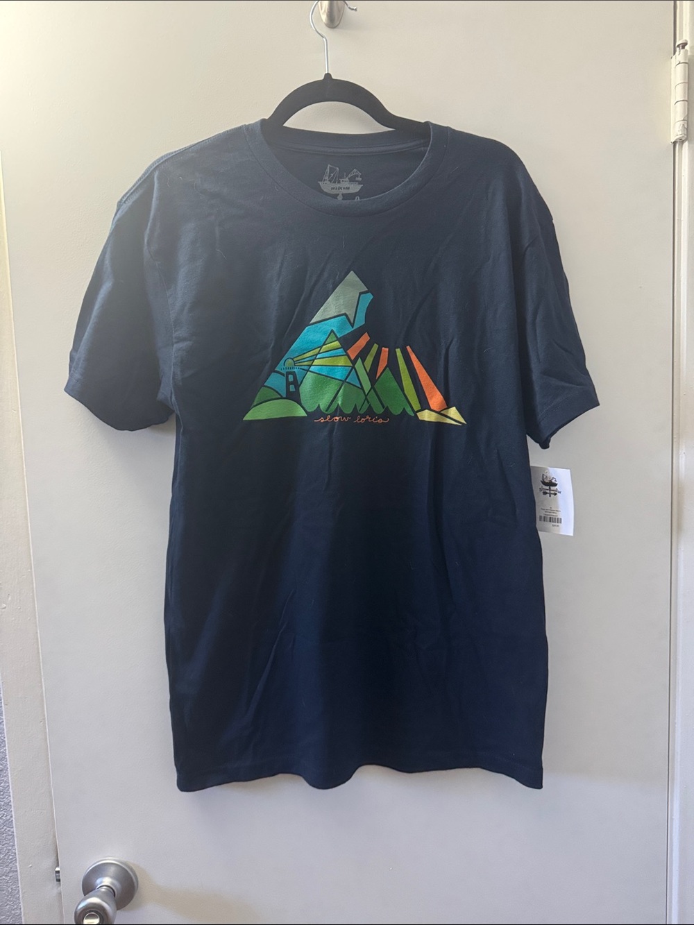 Oris Navy Tee with Multicolor Geometric Mountain Graphic